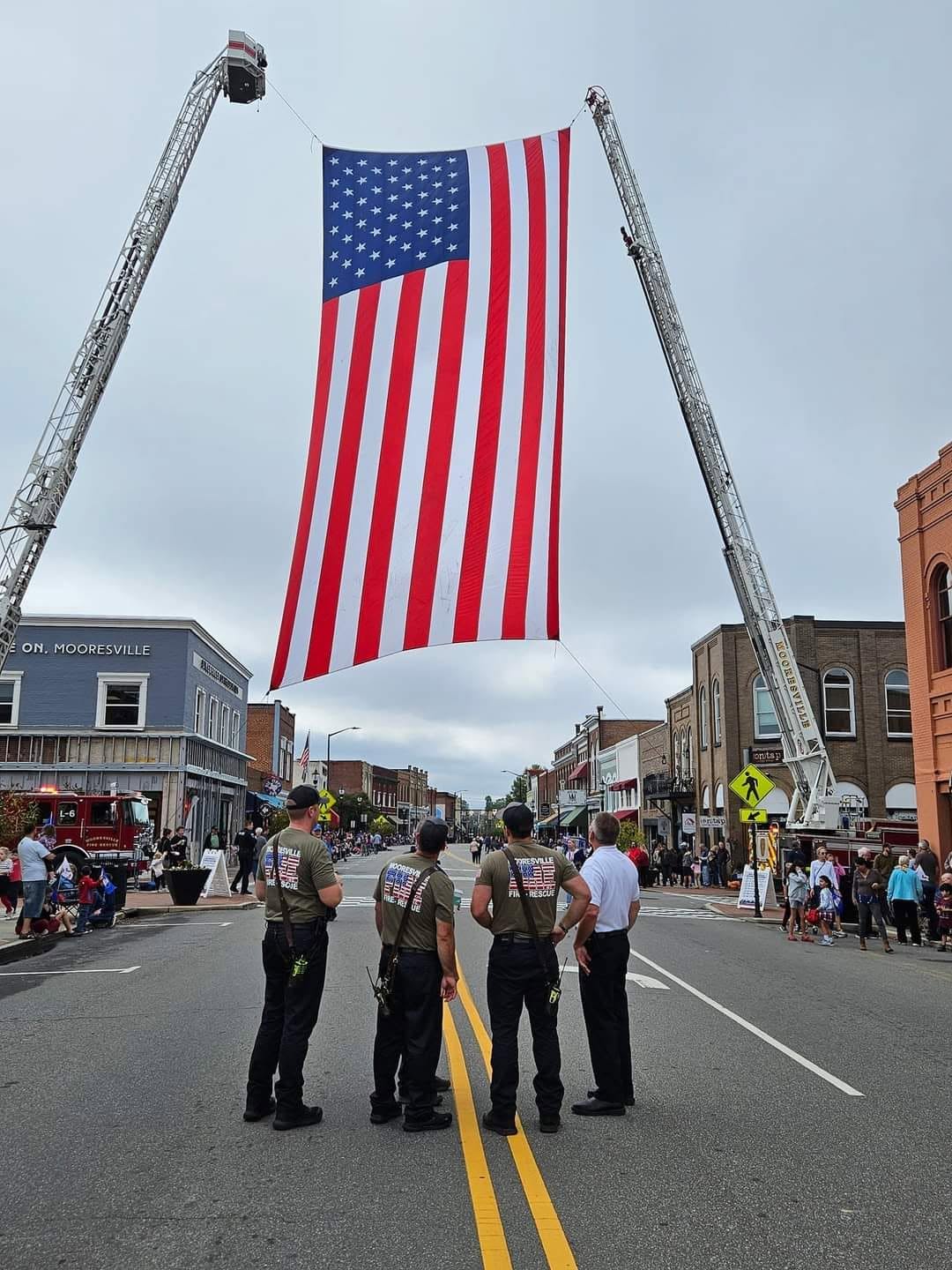 Honor guard members standing watch with the flag