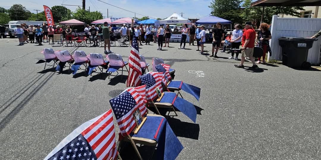 A row of small memorial flags placed in remembrance