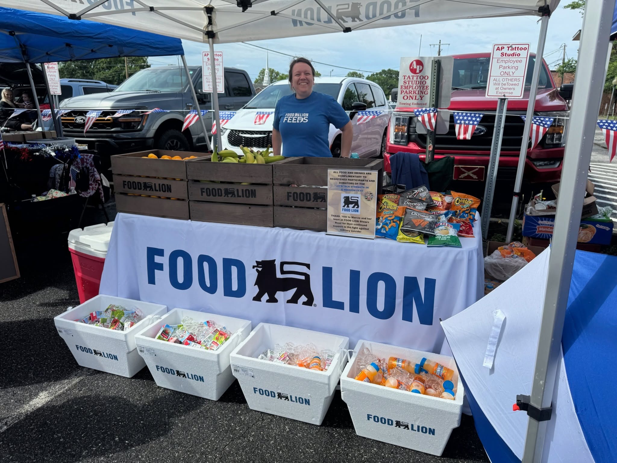 A Food Lion sponsor booth supporting a Let's Talk Strength community drive