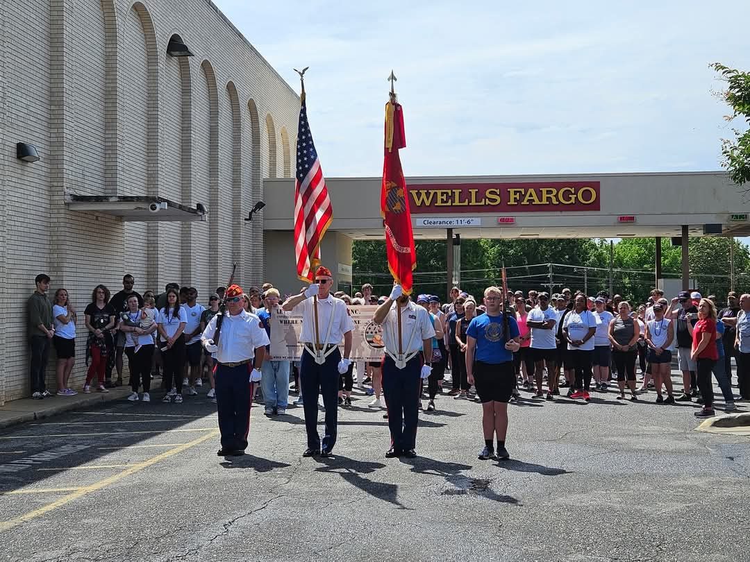 A Marine Corps color guard presenting the colors at a community ceremony