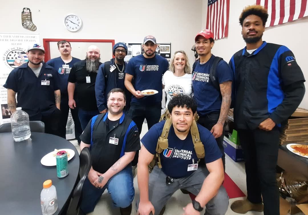 Let's Talk Strength volunteers and partners posing together at a community event